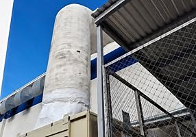 Equipo de aire lavado industrial con ductos en exterior